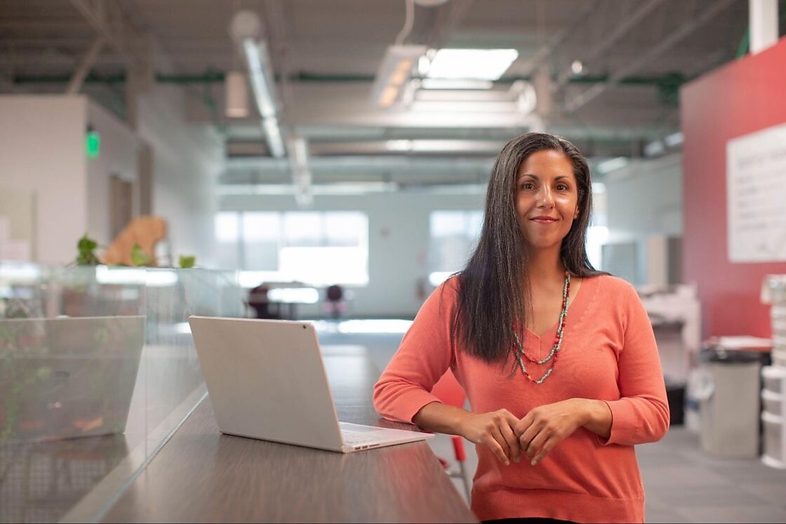 woman standing in front of empty office